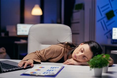 Premium Photo Tired Businesswoman Resting Head On Desk Holding Hand