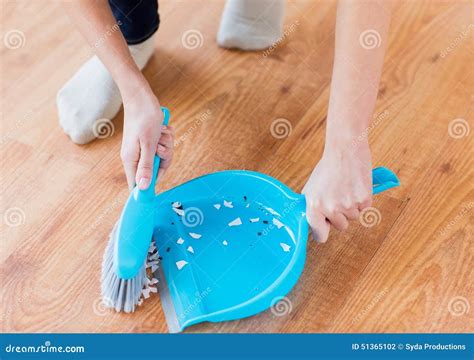 Close Up Of Woman With Brush And Dustpan Sweeping Stock Photo Image