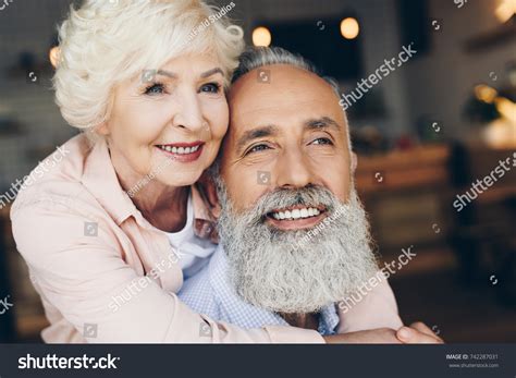 Portrait Smiling Senior Woman Hugging Husband Stock Photo 742287031