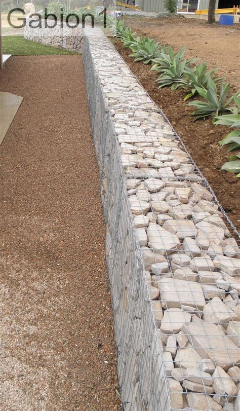 Gabion walls are alternatives to retaining walls that use cages filled with rock, stone or sand to allow for the free flow of water down the slope while providing support for the slope itself. Pin by Gabion & Corten Inc on Gabion Ideas | Landscaping retaining walls, Gabion retaining wall ...