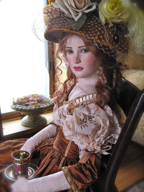 A Woman Sitting In A Chair Wearing A Dress And Hat