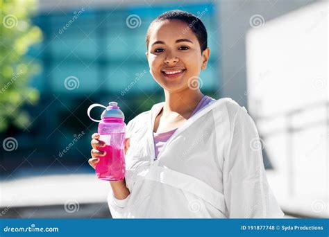 African American Woman Drinking Water From Bottle Stock Photo Image