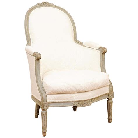 French Louis Xvi Style 1840s Painted Bergère Chair With Carved Floral