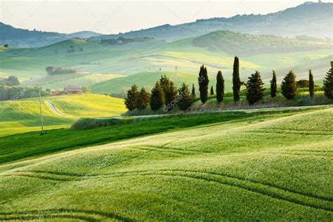 Sunset Over A Spring Landscape Of Tuscany Fields Italy Stock