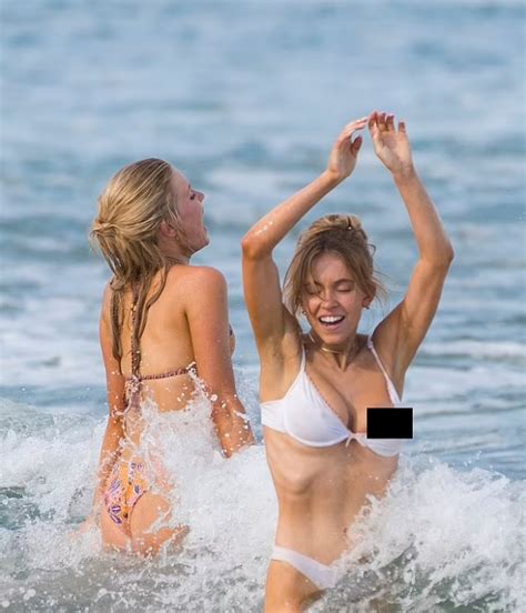 Smiling Sydney Sweeney Suffers A Nip Slip As She Goes Swimming In Sheer Lingerie And Hugs One Of