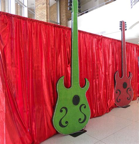 Great addition to your party decor. Rock 'n' Roll backdrop with guitars | #red #rock #party # ...