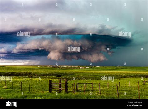Supercell Thunderstorm With Dramatic Clouds Spins Across The Rolling