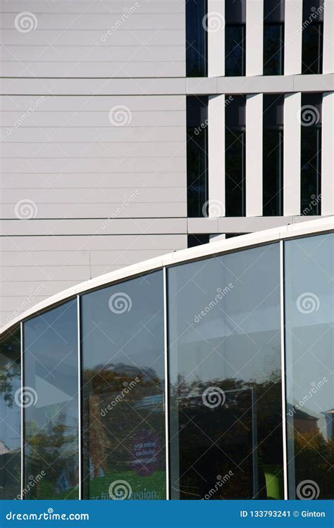 Modern Building With A Corridor Made Of Glass Windows Stock Image