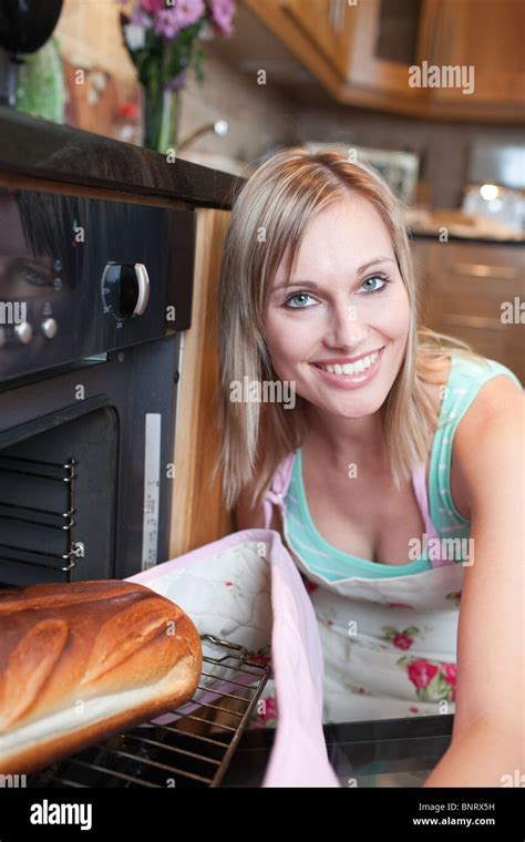 Cheerful Blond Woman Baking Bread Stock Photo Alamy