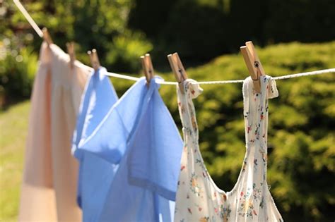 Clean Clothes Hanging On Washing Line In Garden Drying Laundry Stock
