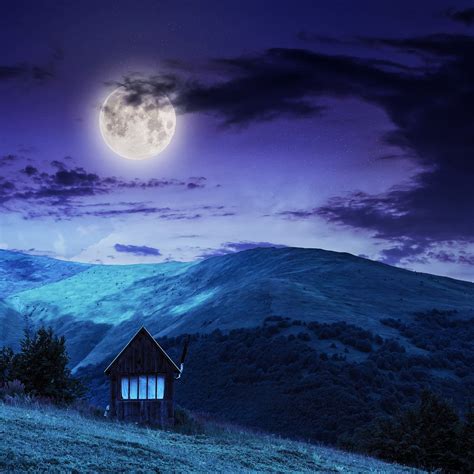 Village On Hillside Meadow With Forest In Mountain At Night Free Photo