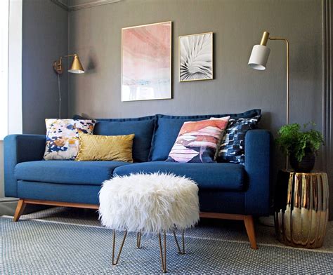 We love the pairing of this white living room with bold blue accents in the shelving and artwork on the walls. Maisons du Monde DUKE sofa | Blue living room decor, Blue sofas living room, Blue sofa living