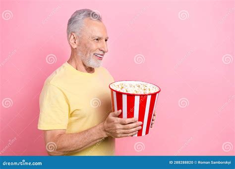 Photo Of Senior Grey Hair Old Man Eating Tasty Bucket Crisps Looking Curious Empty Space New