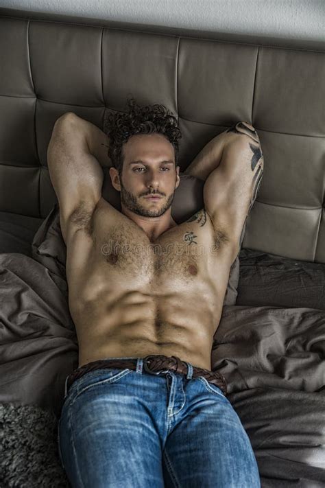 Shirtless Male Model Lying Alone On His Bed Stock Photo Image Of Lonely Seductive