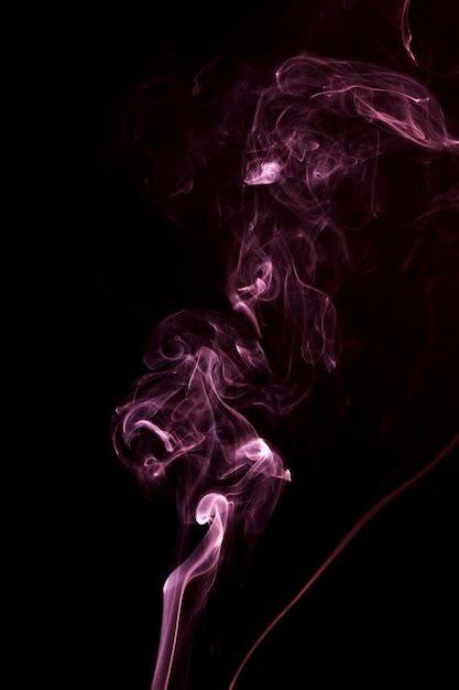Free Photo Spread Of Pink Smoke On The Black Background