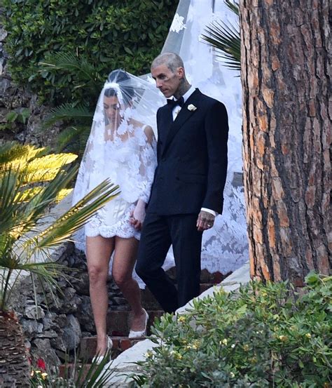 Kourtney Kardashian Marries Travis Barker In Dress Featuring Cathedral