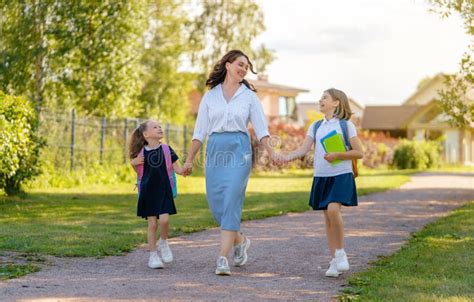 Parent And Pupils Going To School Stock Photo Image Of Backpack