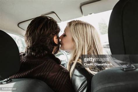 Girl Kissing Man In In Car Photos And Premium High Res Pictures Getty Images