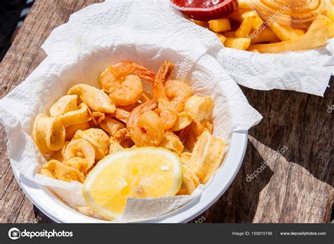 Crispy Fresh Squid And Shrimp In White Plate — Stock Photo © Jukov