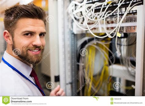 Smiling Technician Standing In A Server Room Stock Photo Image Of