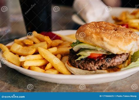 Delicious American Burger With Fries Cooked In A Fast Food Restaurant