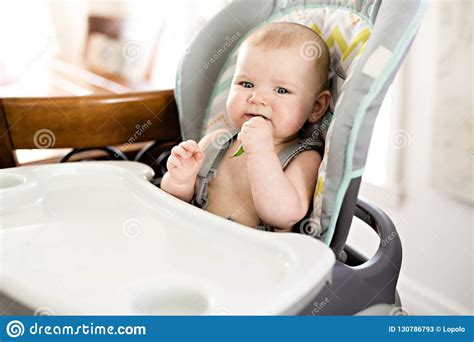 Baby Girl Sitting In High Chair Ready For Eating Stock Image Image Of