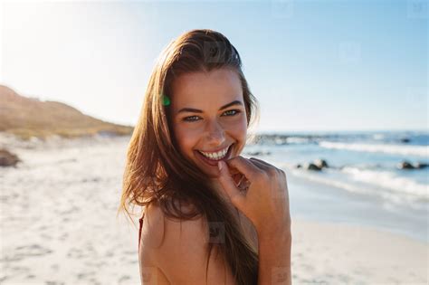 Beautiful Young Woman Smiling On The Beach 122294 Youworkforthem