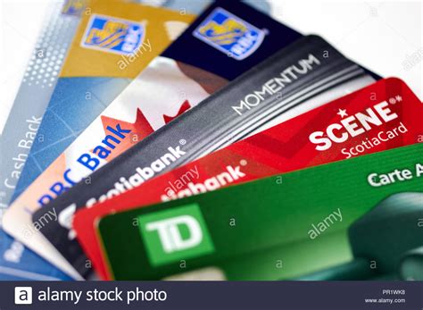 Td bank offers numerous credit card options for consumers. MONTREAL, CANADA - SEPTEMBER 21, 2018: Credit cards of different canadian banks. Scotiabank, RBC ...