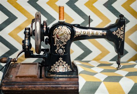 The Side View Of An Old Vintage Sewing Machine Sewing On A Patterned