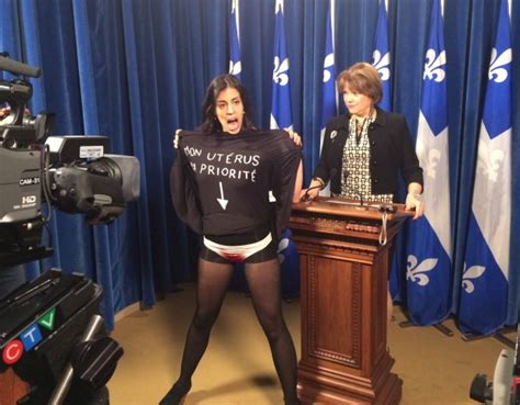 Topless Woman Crashes Quebec Minister S News Conference Ctv News