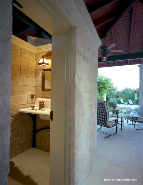 Modern bathroom features a black framed shower enclosure filled with marble tiles fitted with a tiled shower niche as well as a polished. Pool house bathroom Home design ideas