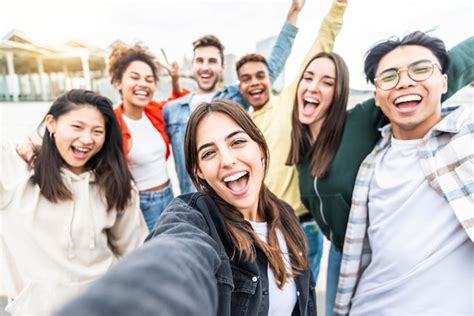 Premium Photo Multiracial Friends Taking Selfie Group Picture With Smart Mobile Phone Outside