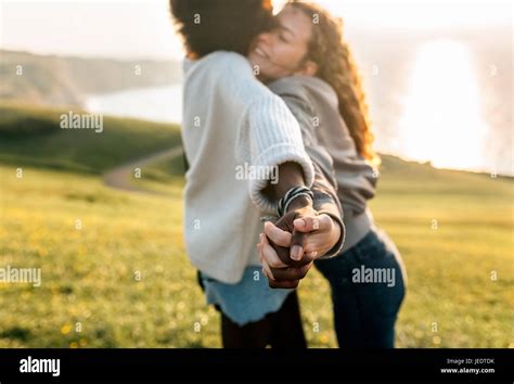 Two Best Friends Holding Hands Outdoors Stock Photo Alamy