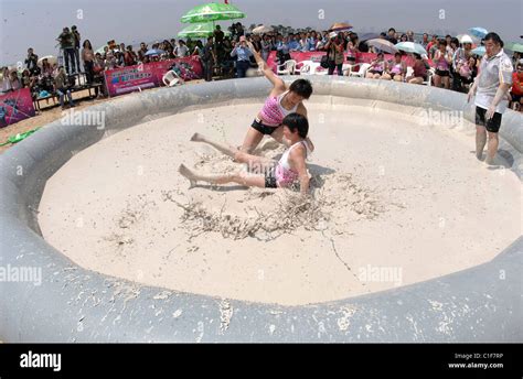 World Mud Wrestling Championships Two Filthy Females Grapple In A Pit During An International