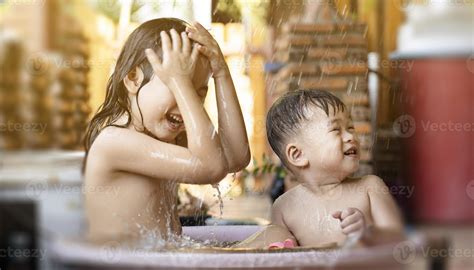 The Older Sister And Brother Were Happily Taking Bath Plastic Tub In The Morning Take A Shower