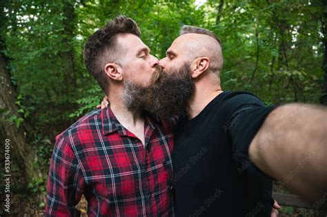 Attractive Hipster Bearded Gay Couple Taking Selfie In The Woods Long