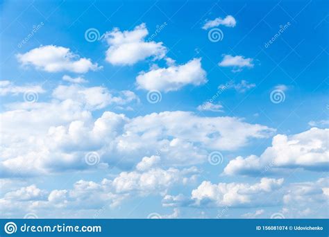 Cloudscape Blue Sky With Large And Small White Clouds Stock Photo