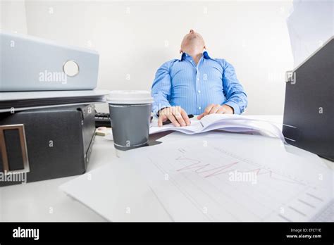 Tired And Overworked Office Worker Stock Photo Alamy