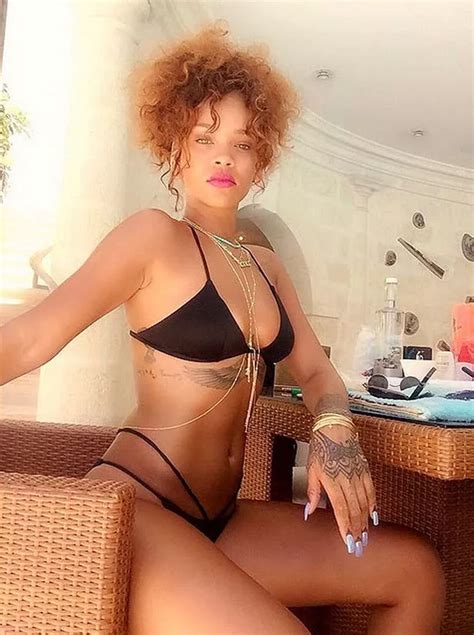 Rihanna Wears A Racy Black Bikini As She Strikes Some Sultry Poses From