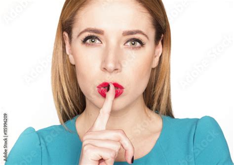 Portrait Of Beautiful Blonde Woman Saying Shh Stock Photo And Royalty