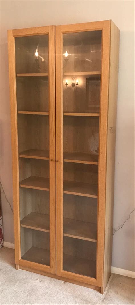 Install wood bookcases to complement a traditional interior design or opt for modern. Ikea billy bookcase oak with glass doors > donkeytime.org