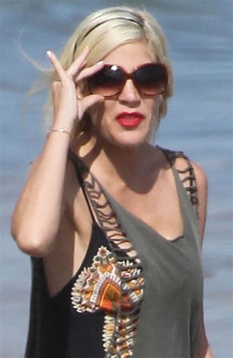 Tori Spelling Bravely Takes Her Wonk Boobs To The Beach