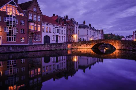 Jan Van Eyckplein Old Town Of Bruges Belgium During Sunset Stock