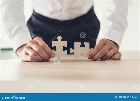 Businessman Matching Two Puzzle Pieces Stock Image Image Of Manager
