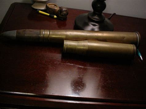 Two Large Ww2 Shell Casings And Projectile