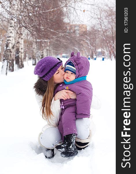 Mother Kissing Holding Baby Winter Free Stock Photos Stockfreeimages