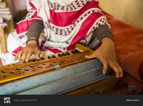 Sadhu Apprentice Playing The Harmonium In The Dandi Swami Ashram Stock