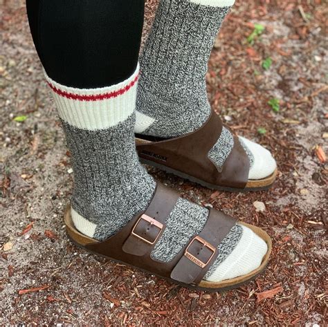 image may contain shoes birkenstocks and socks socks and sandals cabin socks cozy cabin