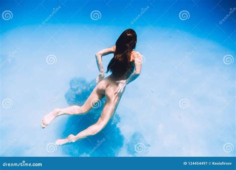 Naked Woman Swim In Sea Underwater In Tropical Ocean Stock Image