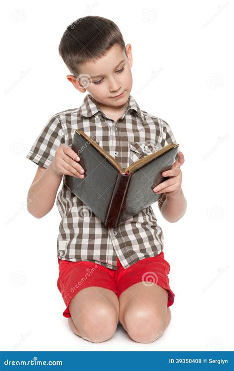 Young Boy Reads An Old Book Stock Photo Image Of Rest Thoughtful